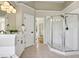 Bright bathroom with glass shower, double vanity, updated fixtures, and natural light at 5420 Avonshire Ln, Cumming, GA 30040