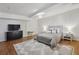 Spacious bedroom with modern furniture and decor, with ample natural light at 5420 Avonshire Ln, Cumming, GA 30040