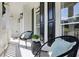 Cozy front porch with seating, black shutters, and ample natural light at 5420 Avonshire Ln, Cumming, GA 30040