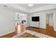 Spacious living room showcasing hardwood floors, recessed lighting, and a modern living area at 5420 Avonshire Ln, Cumming, GA 30040