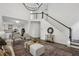 Inviting living room features an open staircase, and views of the kitchen at 5420 Avonshire Ln, Cumming, GA 30040