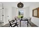Comfortable office with a striking light fixture and views of the outdoors at 5420 Avonshire Ln, Cumming, GA 30040