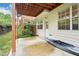 Covered patio with wood columns and a view of the yard and siding of the home at 3505 Chattahoochee Summit Se Ln # 25, Atlanta, GA 30339