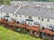 Back of townhomes with wooden decks, backyard patios, and lush greenery at 3505 Chattahoochee Summit Se Ln # 25, Atlanta, GA 30339