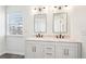 Bathroom features double sinks with a large window offering plenty of natural light at 3505 Chattahoochee Summit Se Ln # 25, Atlanta, GA 30339