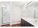 Bright bathroom with a double sink vanity, soaking tub, and a glass enclosed shower at 3505 Chattahoochee Summit Se Ln # 25, Atlanta, GA 30339