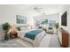 Brightly lit and virtually staged main bedroom with soft color accents and decor at 3505 Chattahoochee Summit Se Ln # 25, Atlanta, GA 30339