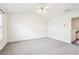 Bright and airy bedroom with neutral carpet, a ceiling fan, and ample space for furniture at 3505 Chattahoochee Summit Se Ln # 25, Atlanta, GA 30339
