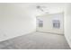 Spacious bedroom with plush carpeting, a ceiling fan, and natural light, perfect for relaxation and comfort at 3505 Chattahoochee Summit Se Ln # 25, Atlanta, GA 30339
