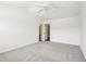 A simple bedroom featuring neutral carpeting, a ceiling fan, and white walls at 3505 Chattahoochee Summit Se Ln # 25, Atlanta, GA 30339