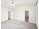 Large bedroom with vaulted ceilings, a ceiling fan, and an en-suite bathroom, offering comfort and convenience at 3505 Chattahoochee Summit Se Ln # 25, Atlanta, GA 30339