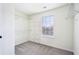 Walk-in closet featuring shelving, a window, and neutral carpeting at 3505 Chattahoochee Summit Se Ln # 25, Atlanta, GA 30339