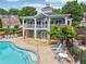 Community clubhouse with a sparkling pool, lounge chairs, and a welcoming atmosphere at 3505 Chattahoochee Summit Se Ln # 25, Atlanta, GA 30339