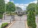 Gated community entrance with well-maintained landscaping and a stylish clubhouse at 3505 Chattahoochee Summit Se Ln # 25, Atlanta, GA 30339