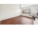 Dining room features a modern chandelier, large window and hardwood floors at 3505 Chattahoochee Summit Se Ln # 25, Atlanta, GA 30339