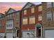 Charming brick townhomes with well-maintained exteriors and welcoming front entrances at 3505 Chattahoochee Summit Se Ln # 25, Atlanta, GA 30339