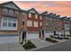 Charming brick townhouses featuring attached garages and inviting curb appeal at 3505 Chattahoochee Summit Se Ln # 25, Atlanta, GA 30339