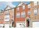 Beautiful brick townhomes with attached garages and well-maintained landscaping at 3505 Chattahoochee Summit Se Ln # 25, Atlanta, GA 30339