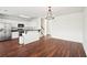 Open kitchen boasts stainless appliances, eat-in bar, and hardwood floors at 3505 Chattahoochee Summit Se Ln # 25, Atlanta, GA 30339