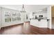 Kitchen featuring white cabinets, a breakfast bar, and stainless steel appliances, perfect for cooking and entertaining at 3505 Chattahoochee Summit Se Ln # 25, Atlanta, GA 30339