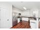 Bright kitchen features stainless steel appliances, granite countertops, and beautiful wood floors at 3505 Chattahoochee Summit Se Ln # 25, Atlanta, GA 30339