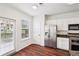 Bright kitchen features stainless steel appliances and access to private deck at 3505 Chattahoochee Summit Se Ln # 25, Atlanta, GA 30339