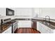 Contemporary kitchen featuring stainless steel appliances, granite countertops, and white cabinetry at 3505 Chattahoochee Summit Se Ln # 25, Atlanta, GA 30339