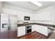 Modern kitchen with stainless steel appliances, white cabinets, and granite countertops at 3505 Chattahoochee Summit Se Ln # 25, Atlanta, GA 30339