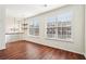 Bright living space with hardwood floors, large windows, and modern chandelier at 3505 Chattahoochee Summit Se Ln # 25, Atlanta, GA 30339