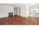 Open-concept living area with fireplace and dark hardwood floors at 3505 Chattahoochee Summit Se Ln # 25, Atlanta, GA 30339