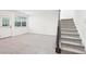 A living room with carpet, stairs and a window overlooking a garden at 3505 Chattahoochee Summit Se Ln # 25, Atlanta, GA 30339