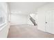 Large living room with a staircase, carpet, and big windows at 3505 Chattahoochee Summit Se Ln # 25, Atlanta, GA 30339