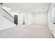 Spacious living room featuring carpet, a staircase, and plenty of natural light at 3505 Chattahoochee Summit Se Ln # 25, Atlanta, GA 30339