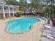 Community pool with ample seating, lounge chairs, and lush greenery; a relaxing outdoor oasis at 3505 Chattahoochee Summit Se Ln # 25, Atlanta, GA 30339