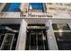A grand entrance of the Metropolitan building with revolving doors and reflective glass at 20 Marietta St. Nw #12D, Atlanta, GA 30303