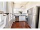 Well-appointed kitchen boasts stainless steel appliances, granite countertops, and white cabinets at 20 Marietta St. Nw #12D, Atlanta, GA 30303