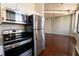 Modern kitchen offering stainless steel appliances and a view of the connecting living space at 20 Marietta St. Nw #12D, Atlanta, GA 30303