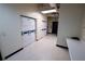 A bright, tidy laundry room contains stacked white washer-dryer units and a folding counter at 20 Marietta St. Nw #12D, Atlanta, GA 30303