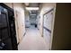 A clean laundry room features stacked white washer-dryer units and vending machines at 20 Marietta St. Nw #12D, Atlanta, GA 30303