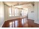 Spacious living room featuring hardwood floors, high ceilings, and views into the kitchen at 20 Marietta St. Nw #12D, Atlanta, GA 30303