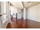 Hardwood floors flow through the open floor plan into the kitchen with stainless appliances at 20 Marietta St. Nw #12D, Atlanta, GA 30303