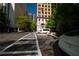 An active city street scene with diverse architecture and pedestrian crosswalks nearby at 20 Marietta St. Nw #12D, Atlanta, GA 30303