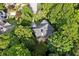 Aerial view showing roof and mature tree coverage with neighborhood surroundings at 6795 Preston Glen Dr, Alpharetta, GA 30005
