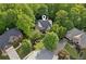 Aerial view of home nestled in a cul-de-sac surrounded by mature trees at 6795 Preston Glen Dr, Alpharetta, GA 30005