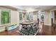 Finished basement offers a poker table and hardwood flooring, perfect for entertaining at 6795 Preston Glen Dr, Alpharetta, GA 30005