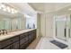 Large main bathroom with double sinks, granite countertops, and a walk-in shower at 6795 Preston Glen Dr, Alpharetta, GA 30005