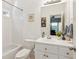 Bright bathroom with a shower-tub combination and white vanity at 6795 Preston Glen Dr, Alpharetta, GA 30005