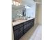 Elegant bathroom featuring dual sinks, granite countertops, and a glass-enclosed shower at 6795 Preston Glen Dr, Alpharetta, GA 30005