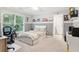 Comfortable bedroom featuring natural light, a desk, and carpeted floors at 6795 Preston Glen Dr, Alpharetta, GA 30005