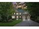 Charming two-story brick home with attached two-car garage and manicured lawn at 6795 Preston Glen Dr, Alpharetta, GA 30005
